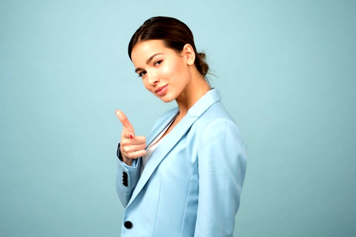 Confident woman pointing at camera 