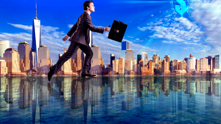 Business man creating a sales lane walking on water past city scape