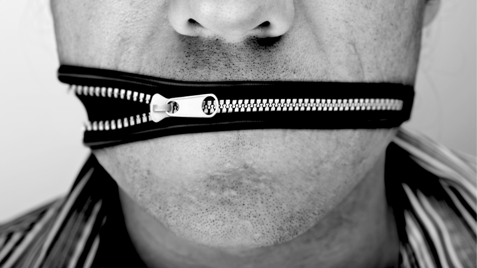 Man with zipper on mouth because of over talk at sales pitch