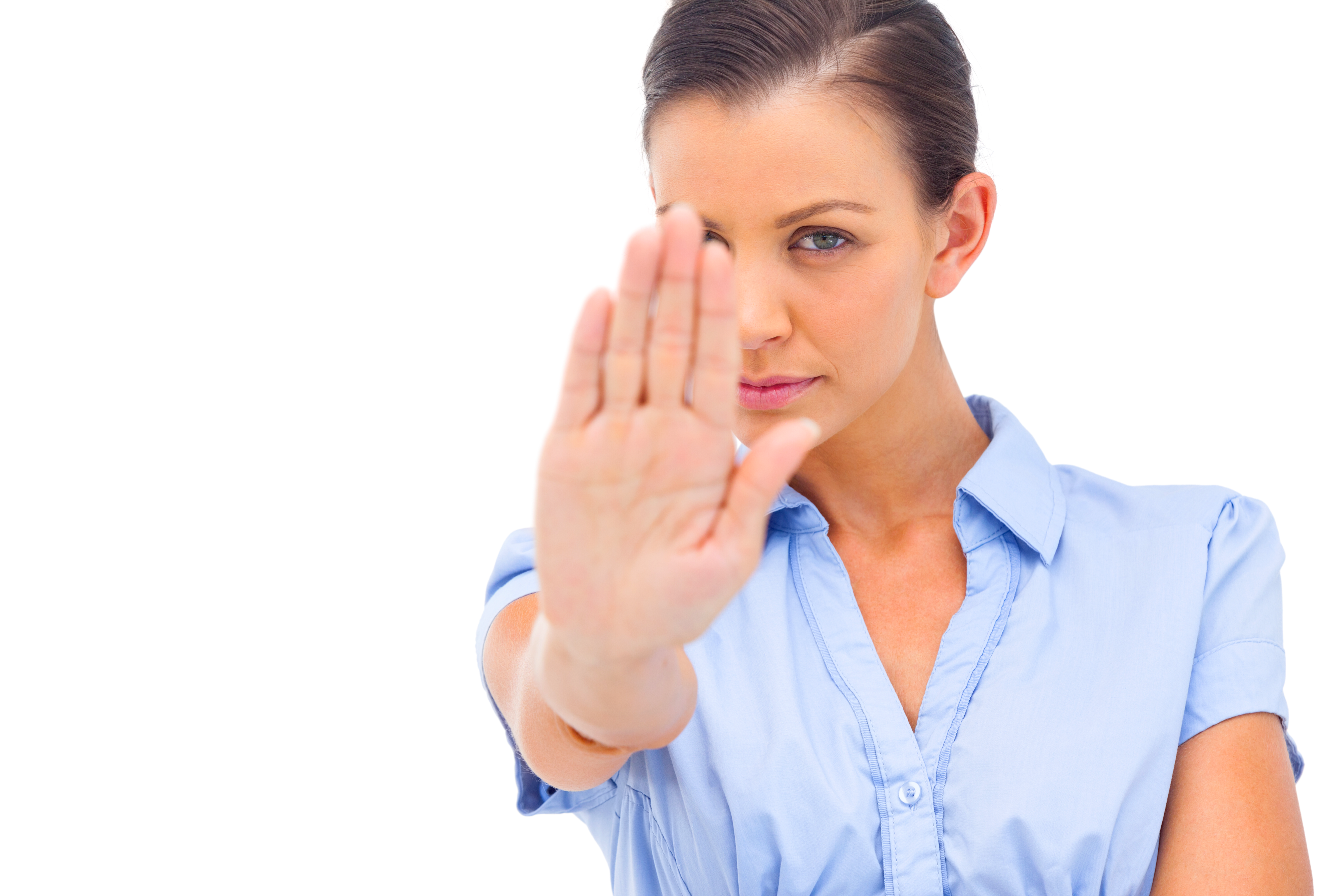 Gatekeeper fending off salesperson by gesturing stop